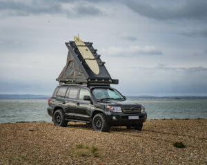 Roof tent up on the Land Cruiser at the beach