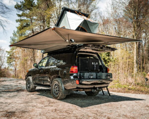 Fully extended awning with the roof tent erected on the Toyota Land Cruiser