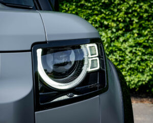 Satin grey with gloss black trim around the headlights