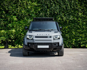 Satin grey new Defender with gloss black accents - front view