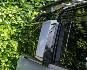 Gloss black side-mounted gear carrier on the new Defender