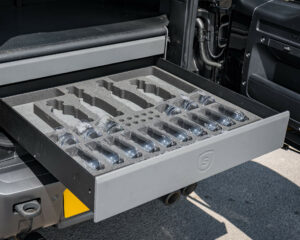 Hospitality drawer for new Defender, trimmed in grey leather