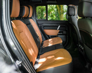 Matching tan leather door card and rear seats in Land Rover Defender