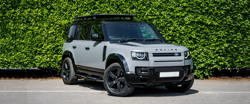 Satin wrapped new Land Rover Defender 110 with gloss black accents