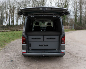 Drawer system with fold out mattress for camping in a VW Transporter