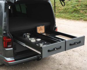 Fully extended top storage drawers in a VW Transporter