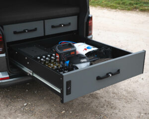 Custom storage drawer installed in a VW Transporter with Jackery and built-in fridge