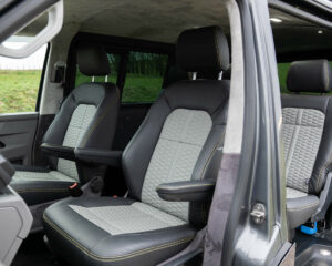 Custom two-tone grey seats with hex pattern and yellow contrast stitching for Volkswagen Transporter